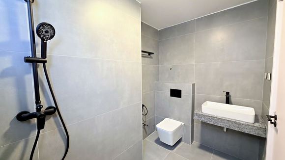 Bathroom with a walk in rain shower and stone vanity